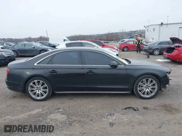 2012 Audi A8 с VIN WAUAVAFD0CN035731, выставлен на аукционе IAAI как лот 41286022 с пробегом 82 835 миль миль и . История ставок и продаж доступна на DreamBid. Изображение 14.