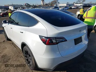 2023 Tesla Model Y Long Range with VIN 7SAYGDEE1PA128818, listed as a IAAI auction lot 41622062 with 19,089 mi miles. Bid and sale history available at carsss.com. Image 3.