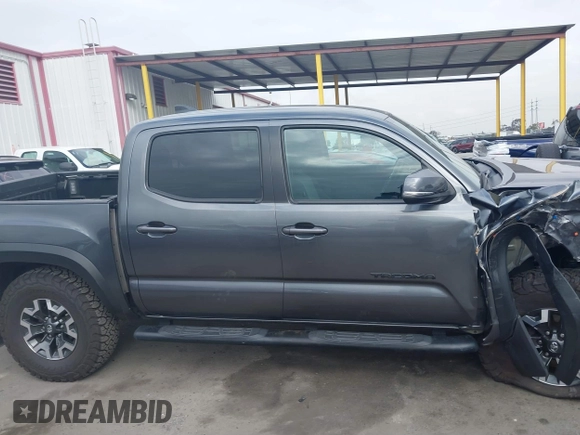 2021 Toyota Tacoma SR z VIN 3TMCZ5AN9MM397611, wystawiony jako IAAI lot #41467705 z przebiegiem 65 191 mil mil oraz . Historia ofert i sprzedaży dostępna na DreamBid. Obrazek 13.
