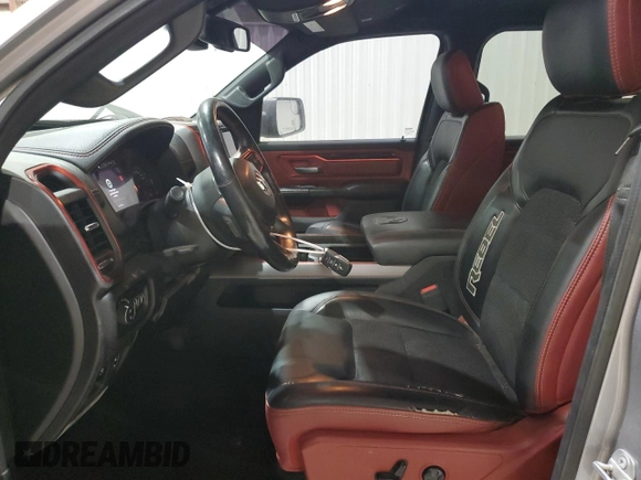 2019 Ram 1500 Rebel z VIN 1C6SRFLT3KN671103, wystawiony jako Copart lot #49518485 z przebiegiem 134 232 mil mil oraz Czysty tytuł • Clean title. Historia ofert i sprzedaży dostępna na DreamBid. Obrazek 7.