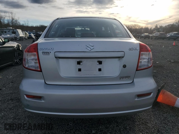 2011 Suzuki SX4 LE z VIN JS2YC5A23B6300189, wystawiony jako Copart lot #85389574 z przebiegiem 71 272 mil mil oraz Czysty tytuł • Clean title. Historia ofert i sprzedaży dostępna na DreamBid. Obrazek 6.
