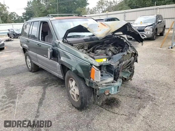 1995 Jeep Grand Cherokee Laredo with VIN 1J4FX58S0SC726476, listed as a Copart auction lot 69608784 with 264,705 mi miles and Salvage Title. Bid and sale history available at carsss.com. Image 12.