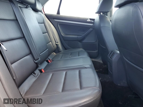 2009 Volkswagen Jetta SE with VIN 3VWRZ71K69M177746, listed as a Copart auction lot 70990074 with 128,390 mi miles and Salvage title. Bid and sale history available at DreamBid. Image 10.