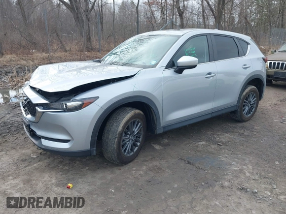 2021 Mazda CX-5 Touring with VIN JM3KFBCM9M1329806, listed as a IAAI auction lot 41825123 with 59,300 mi miles. Bid and sale history available at carsss.com. Image 2.