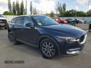 2018 Mazda CX-5 Grand Touring with VIN JM3KFADMXJ1353942, listed as a Copart auction lot 60570835 with 74,400 mi miles and Clean title. Bid and sale history available at DreamBid. Image 4.