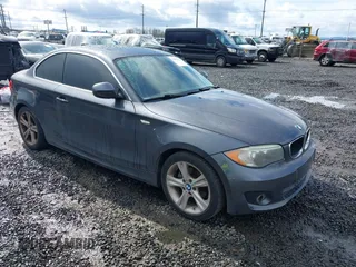 2013 BMW 1 Series 128i with VIN WBAUP7C5XDVP24796, listed as a IAAI auction lot 41807533 with 157,614 mi miles and . Bid and sale history available at carsss.com. Image 1.