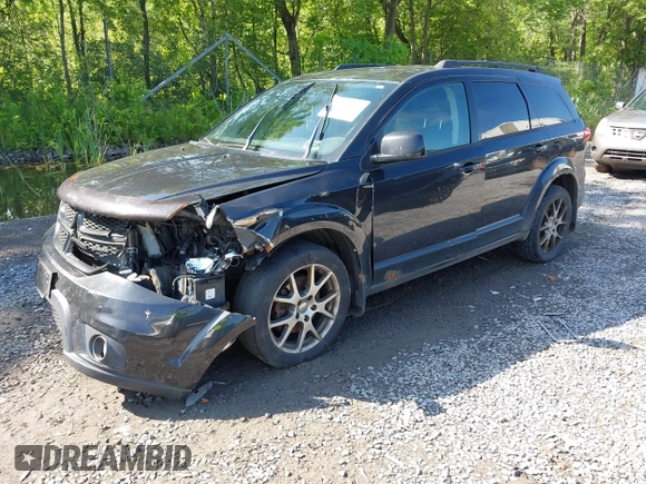 2013 Dodge Journey R/T with VIN 3C4PDDEG4DT691056, listed as a IAAI auction lot 42535196 with 198,307 mi miles and . Bid and sale history available at DreamBid. Image 2.