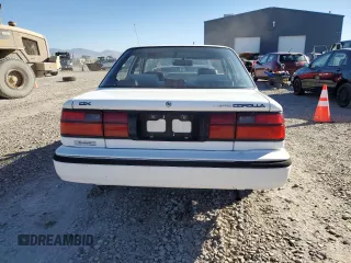 1992 Toyota Corolla z VIN JT2AE94A1N0300157, wystawiony jako Copart lot #77783474 z przebiegiem 180 103 mil mil oraz Czysty tytuł • Clean title. Historia ofert i sprzedaży dostępna na DreamBid. Obrazek 6.