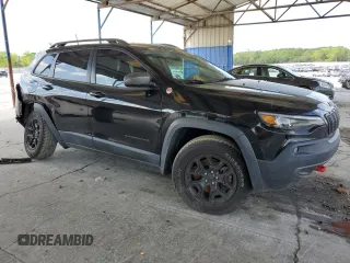 2019 Jeep Cherokee Trailhawk with VIN 1C4PJMBN7KD374676, listed as a Copart auction lot 51504125 with 34,323 mi miles and Salvage Title. Bid and sale history available at DreamBid. Image 4.