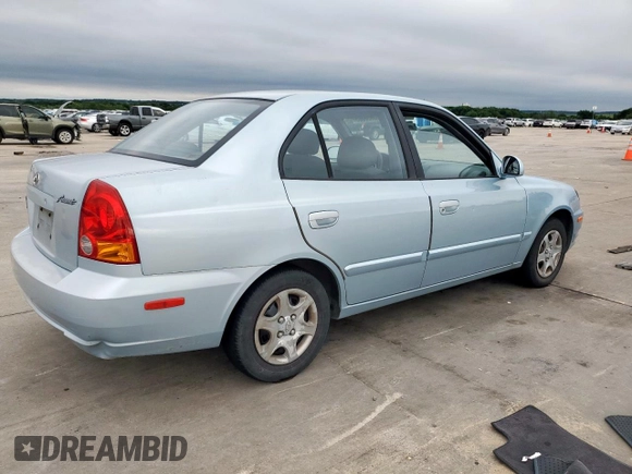 2003 Hyundai Accent GL z VIN KMHCG45C73U481294, wystawiony jako Copart lot #55958005 z przebiegiem 136 964 mil mil oraz Czysty tytuł • Clean title. Historia ofert i sprzedaży dostępna na DreamBid. Obrazek 3.