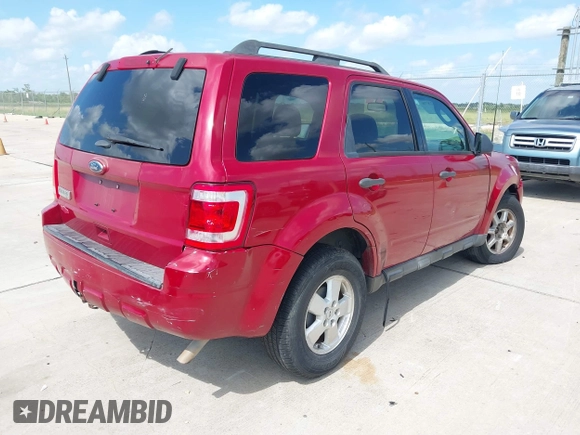 2011 Ford Escape XLT with VIN 1FMCU9D70BKC38169, listed as a IAAI auction lot 42802876 with 233,249 mi miles and . Bid and sale history available at DreamBid. Image 4.