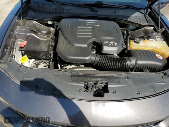 2015 Dodge Charger SXT with VIN 2C3CDXHG8FH794623, listed as a Copart auction lot 52000144 with 145,624 mi miles and Salvage Title. Bid and sale history available at DreamBid. Image 12.