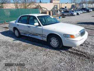 1999 Mercury Grand Marquis GS z VIN 2MEFM74W0XX686623, wystawiony jako IAAI lot #41828993 z przebiegiem 245 171 mil mil oraz . Historia ofert i sprzedaży dostępna na DreamBid. Obrazek 1.