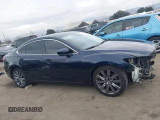2018 Mazda 6 Grand Touring with VIN JM1GL1TY3J1334600, listed as a IAAI auction lot 41060893 with 64,852 mi miles and . Bid and sale history available at DreamBid. Image 14.