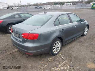 2014 Volkswagen Jetta Sedan SE w/Connectivity with VIN 3VWD17AJ2EM217534, listed as a IAAI auction lot 41872938 with 99,764 mi miles. Bid and sale history available at carsss.com. Image 4.