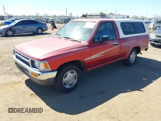 1992 Toyota Pickup DLX z VIN 4TARN81PXNZ030799, wystawiony jako IAAI lot #41879500 z przebiegiem 221 198 mil mil oraz . Historia ofert i sprzedaży dostępna na DreamBid. Obrazek 2.
