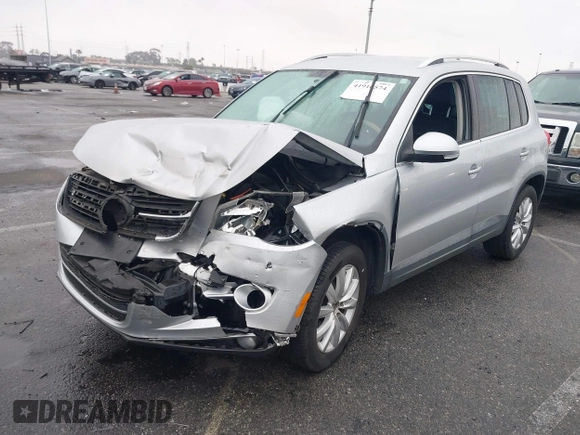2011 Volkswagen Tiguan SEL w/Premium Navi with VIN WVGAV7AX7BW547613, listed as a IAAI auction lot 41916574 with 140,385 mi miles and . Bid and sale history available at DreamBid. Image 2.