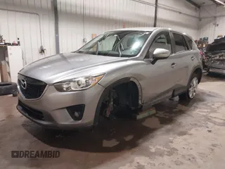 2015 Mazda CX-5 Grand Touring with VIN JM3KE4DY2F0477966, listed as a IAAI auction lot 41247178 with 116,582 mi miles. Bid and sale history available at carsss.com. Image 2.