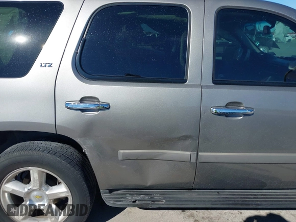 2007 Chevrolet Tahoe LTZ with VIN 1GNFC13J97R155705, listed as a IAAI auction lot 40914171 with 165,727 mi miles and . Bid and sale history available at DreamBid. Image 13.