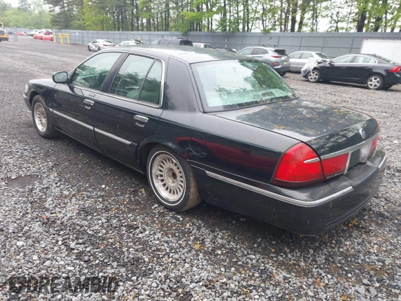 2002 Mercury Grand Marquis LS Premium z VIN 2MEFM75W42X644236, wystawiony jako IAAI lot #42276863 z przebiegiem 56 460 mil mil oraz . Historia ofert i sprzedaży dostępna na DreamBid. Obrazek 3.