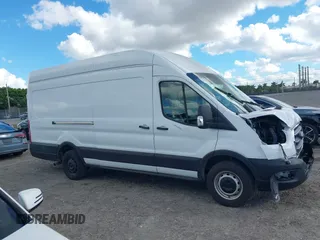 2021 Ford Transit Cargo with VIN 1FTBW3X8XMKA14051, listed as a IAAI auction lot 41672248 with 127,438 mi miles. Bid and sale history available at carsss.com. Image 14.