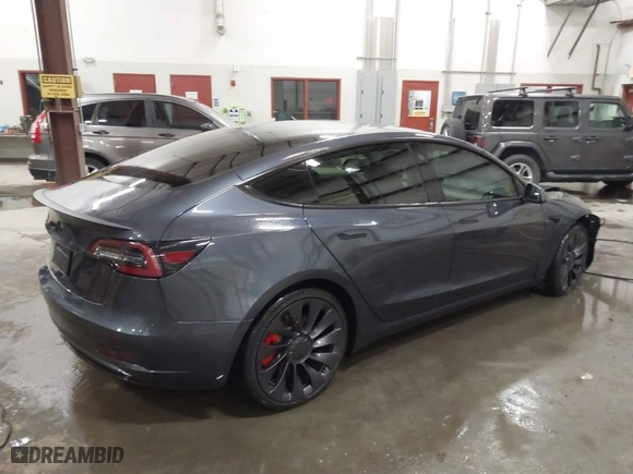 2021 Tesla Model 3 Performance with VIN 5YJ3E1EC3MF044802, listed as a IAAI auction lot 41891096 with 56,001 mi miles. Bid and sale history available at carsss.com. Image 4.
