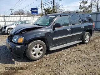 2003 GMC Envoy SLT z VIN 1GKET16PX36243554, wystawiony jako Copart lot #49083975 z przebiegiem 148 596 mil mil oraz Szkody całkowita. Historia ofert i sprzedaży dostępna na DreamBid. Obrazek 1.