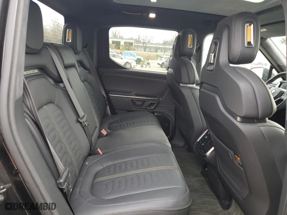 2023 Rivian R1T Adventure with VIN 7FCTGBAAXPN028326, listed as a Copart auction lot 50259015 with 27,908 mi miles and Salvage Title. Bid and sale history available at carsss.com. Image 10.