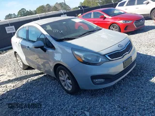 2014 Kia Rio EX with VIN KNADN4A33E6338674, listed as a IAAI auction lot 41659426 with 208,967 mi miles. Bid and sale history available at carsss.com. Image 1.