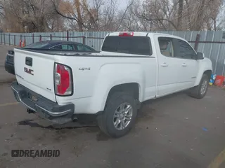 2019 GMC Canyon 4WD SLE z VIN 1GTG6CEN5K1297945, wystawiony jako IAAI lot #41308105 z przebiegiem 93 226 mil mil oraz . Historia ofert i sprzedaży dostępna na DreamBid. Obrazek 4.