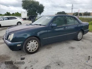 1997 Mercedes-Benz E-Class with VIN WDBJF55F4VJ025769, listed as a Copart auction lot 73460164 with 0 mi miles and Salvage Title. Bid and sale history available at carsss.com. Image 1.