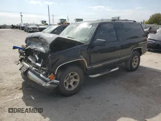 1999 Chevrolet Tahoe z VIN 3GNEC18R3XG165012, wystawiony jako Copart lot #75803204 z przebiegiem 227 608 mil mil oraz Szkoda całkowita • Salvage title. Historia ofert i sprzedaży dostępna na DreamBid. Obrazek 1.