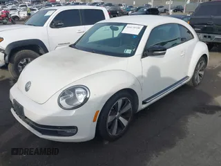 2012 Volkswagen Beetle 2.0T Turbo w/Sun/Snd/Nav PZEV with VIN 3VWVA7ATXCM620731, listed as a IAAI auction lot 41074530 with 99,236 mi miles. Bid and sale history available at carsss.com. Image 17.