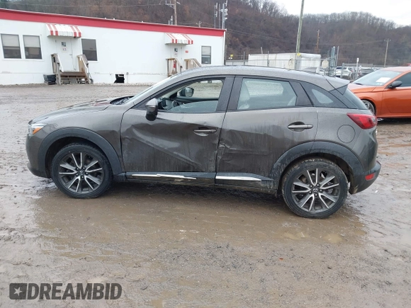 2016 Mazda CX-3 Grand Touring with VIN JM1DKBD77G0107328, listed as a IAAI auction lot 41682949 with 156,935 mi miles. Bid and sale history available at carsss.com. Image 14.