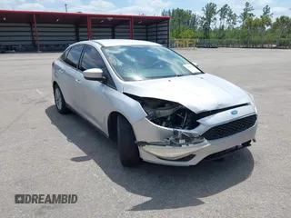 2018 Ford Focus SE z VIN 1FADP3FE9JL241661, wystawiony jako IAAI lot #42103513 z przebiegiem 117 003 mil mil oraz . Historia ofert i sprzedaży dostępna na DreamBid. Obrazek 6.