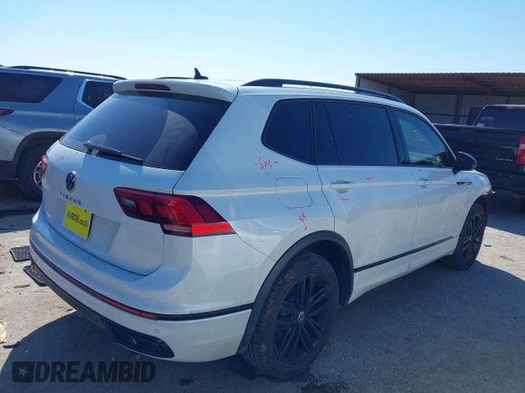 2022 Volkswagen Tiguan SE R-Line Black with VIN 3VVCB7AX4NM165115, listed as a IAAI auction lot 41624320 with 18,074 mi miles and . Bid and sale history available at DreamBid. Image 4.
