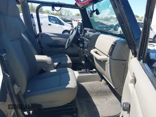 2004 Jeep Wrangler Sahara with VIN 1J4FA59S74P801296, listed as a IAAI auction lot 42049291 with 152,208 mi miles and . Bid and sale history available at DreamBid. Image 5.