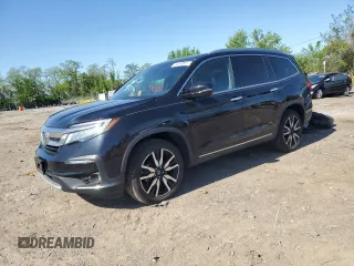2020 Honda Pilot Touring 7-Passenger z VIN 5FNYF6H64LB020948, wystawiony jako Copart lot #54299055 z przebiegiem 76 573 mil mil oraz Szkoda całkowita • Salvage title. Historia ofert i sprzedaży dostępna na DreamBid. Obrazek 1.