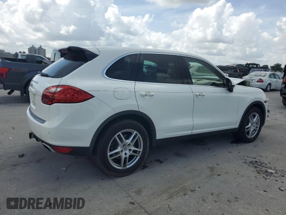 2012 Porsche Cayenne with VIN WP1AA2A23CLA02615, listed as a Copart auction lot 64604655 with 131,536 mi miles and Salvage title. Bid and sale history available at DreamBid. Image 3.