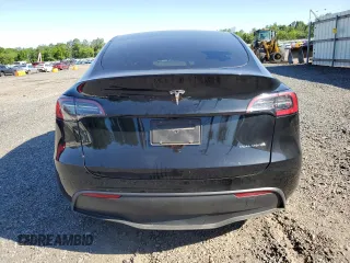 2023 Tesla Model Y Long Range z VIN 7SAYGDEE1PF865195, wystawiony jako Copart lot #57455765 z przebiegiem 32 011 mil mil oraz Szkoda całkowita • Salvage title. Historia ofert i sprzedaży dostępna na DreamBid. Obrazek 6.