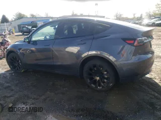 2023 Tesla Model Y Long Range z VIN 7SAYGAEE3PF596826, wystawiony jako Copart lot #50513045 z przebiegiem 30 747 mil mil oraz Szkoda całkowita • Salvage title. Historia ofert i sprzedaży dostępna na DreamBid. Obrazek 2.