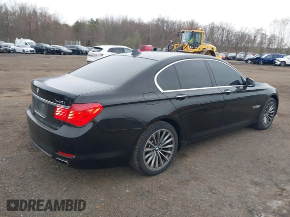 2011 BMW 7 Series 740i with VIN WBAKA4C55BC612584, listed as a IAAI auction lot 42021367 with 139,190 mi miles. Bid and sale history available at carsss.com. Image 4.