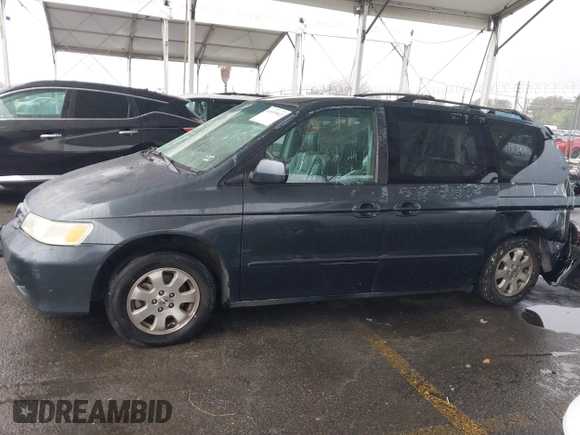 2004 Honda Odyssey EX-L with VIN 5FNRL18974B015769, listed as a IAAI auction lot 41533063 with 284,923 mi miles and . Bid and sale history available at DreamBid. Image 14.