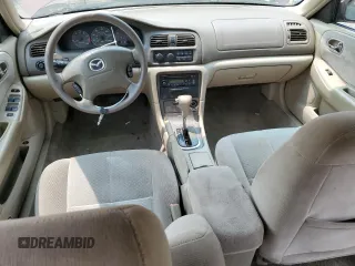 2000 Mazda 626 LX z VIN 1YVGF22C4Y5112874, wystawiony jako Copart lot #58952175 z przebiegiem 100 070 mil mil oraz Szkoda całkowita • Salvage title. Historia ofert i sprzedaży dostępna na DreamBid. Obrazek 8.