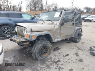 2003 Jeep Wrangler X with VIN 1J4FA39SX3P329386, listed as a IAAI auction lot 41407594 with 140,390 mi miles. Bid and sale history available at carsss.com. Image 2.