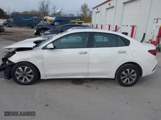 2023 Kia Rio S with VIN 3KPA24AD7PE624354, listed as a IAAI auction lot 40853857 with 25,404 mi miles. Bid and sale history available at carsss.com. Image 14.