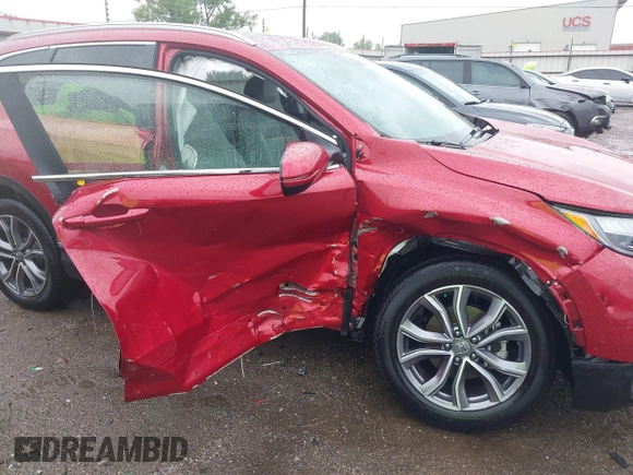 2021 Honda CR-V Touring with VIN 2HKRW2H9XMH663315, listed as a IAAI auction lot 42188893 with 26,203 mi miles and . Bid and sale history available at DreamBid. Image 6.