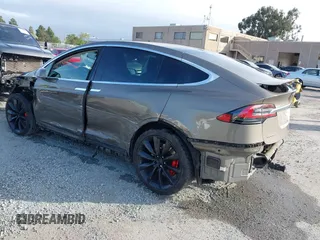 2016 Tesla Model X P90D with VIN 5YJXCAE45GF000773, listed as a IAAI auction lot 42052642 with 127,670 mi miles. Bid and sale history available at carsss.com. Image 3.