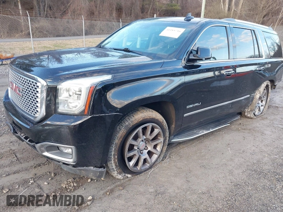 2016 GMC Yukon Denali with VIN 1GKS2CKJ2GR412201, listed as a IAAI auction lot 41185716 with 124,421 mi miles. Bid and sale history available at carsss.com. Image 2.