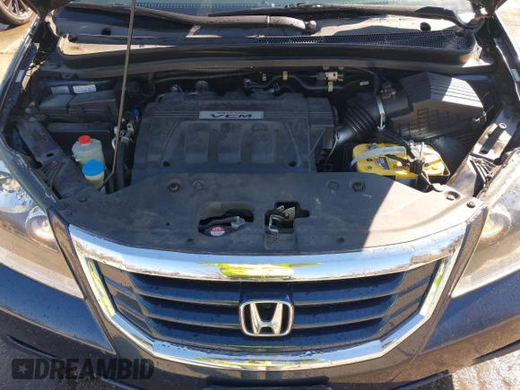 2010 Honda Odyssey EX-L with VIN 5FNRL3H76AB058912, listed as a IAAI auction lot 41558361 with 206,841 mi miles and . Bid and sale history available at DreamBid. Image 10.